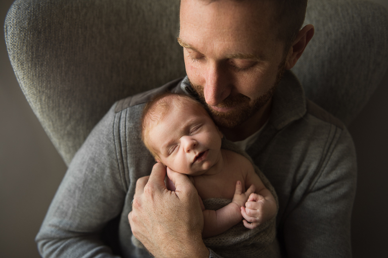 Father and newborn baby son portrait