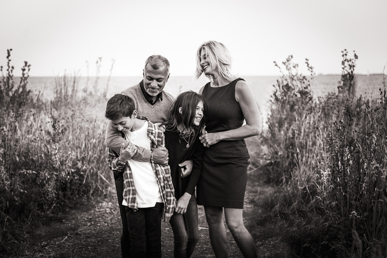 black and white photo of family in prairie
