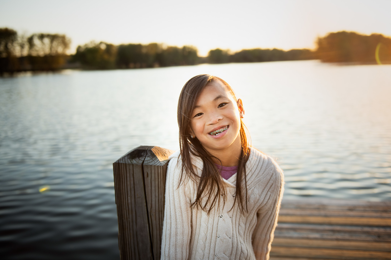 girl-on-dock-by-lake-photo